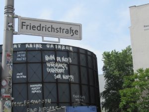 A sign reading 'Friedrichsstrasse' ie the mian road through Checkpoint Charlie in Berlin, Germany