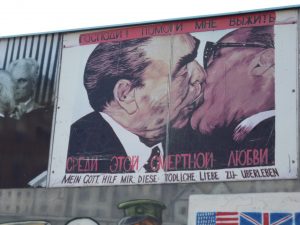 Painted picture of Russian leader Brezhnev exchanging a ‘socialist fraternal kiss’ with Erich Honecker, at the East Side Gallery, ie part of the Berlin Wall
